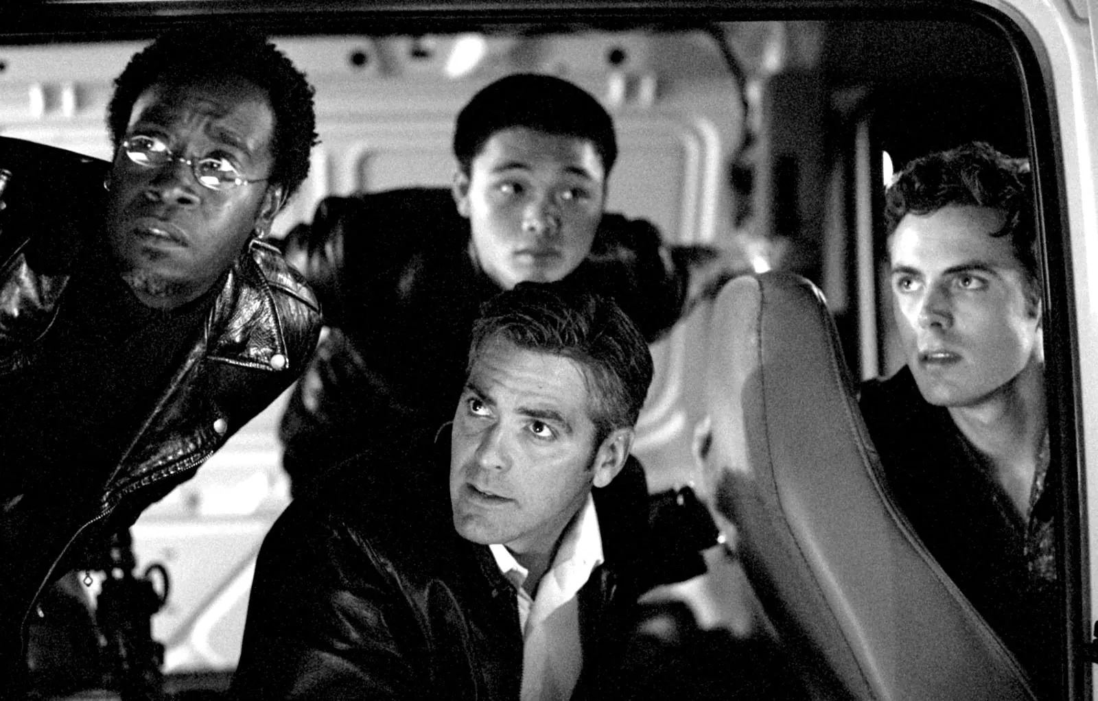Basher, Yen, Danny and Virgil in the back of a van