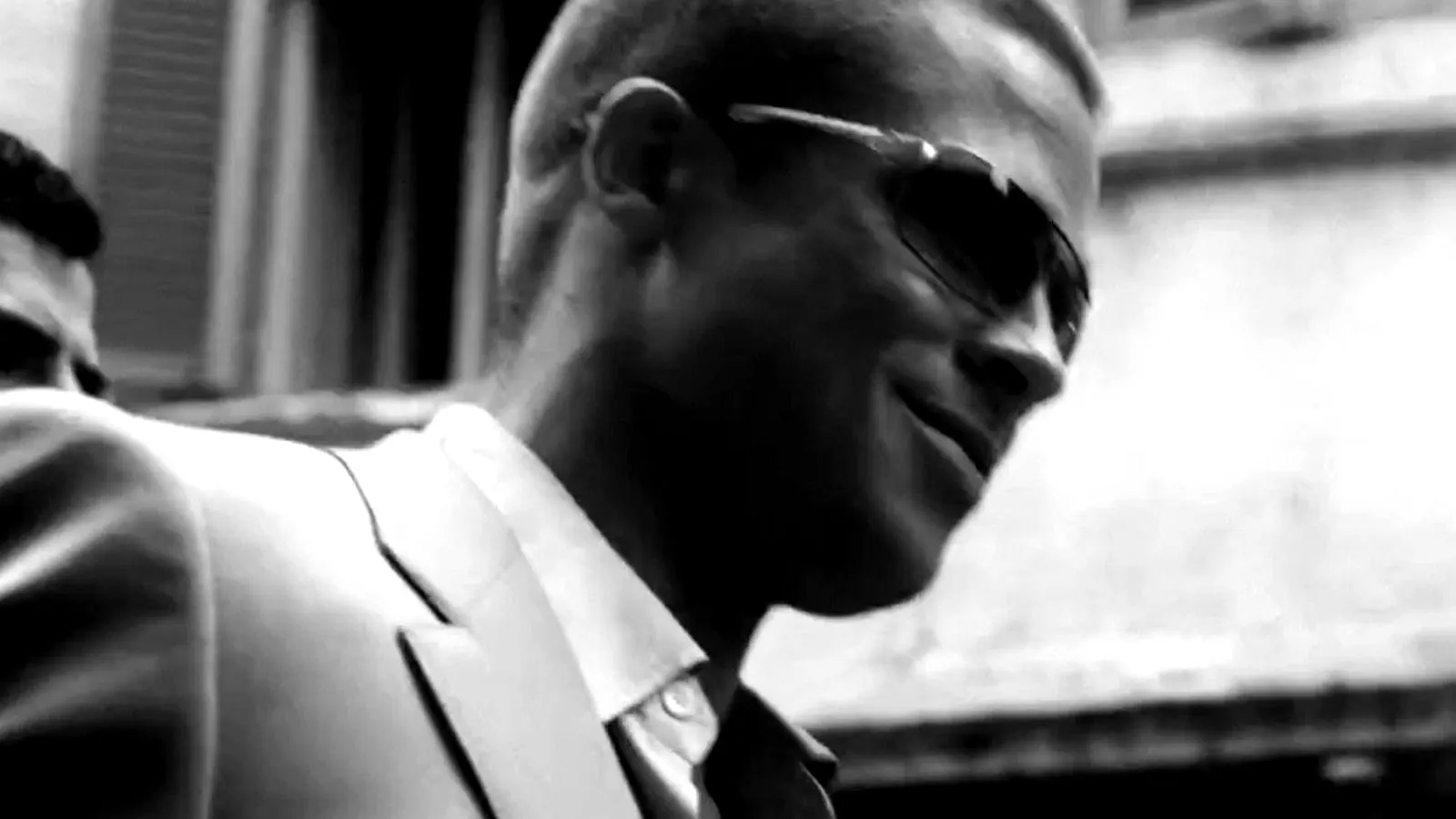 Rusty in sunglasses, close-up, black and white