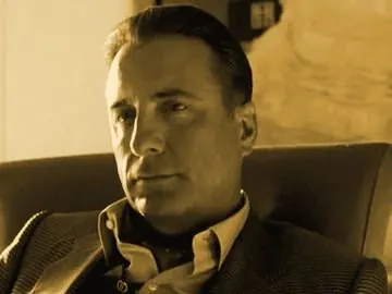 Terry Benedict seated, gold tone