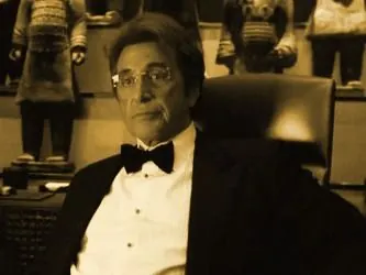 Willy Bank in a tuxedo, seated