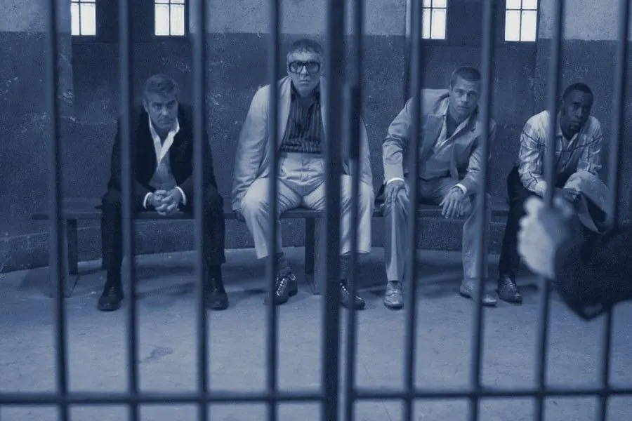 The crew behind bars in a police cell